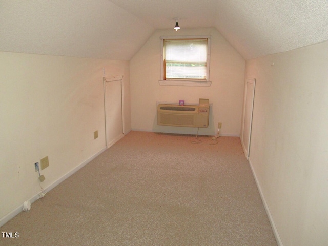 1159 Flemingtown Rd, Henderson, NC 27537 - bonus room featuring an AC wall unit, vaulted ceiling, and carpet flooring