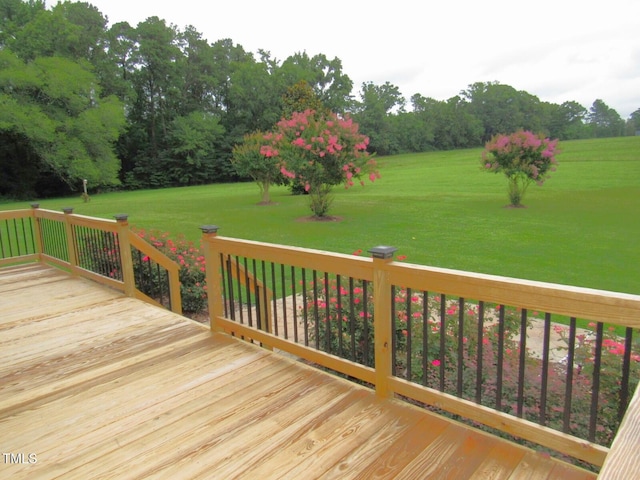1159 Flemingtown Rd, Henderson, NC 27537 - deck with a lawn and view of wooded area