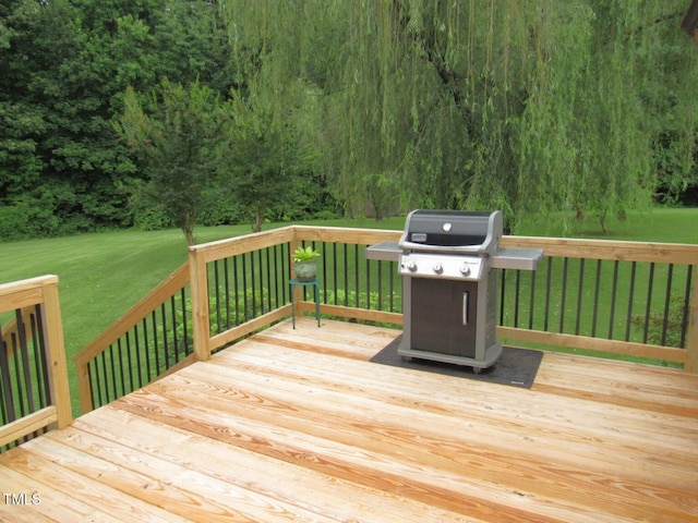 1159 Flemingtown Rd, Henderson, NC 27537 - wooden terrace featuring grilling area, a yard, and a wooded view