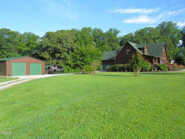 1159 Flemingtown Rd, Henderson, NC 27537 - view of green lawn with a detached garage, driveway, an outdoor structure, and a carport