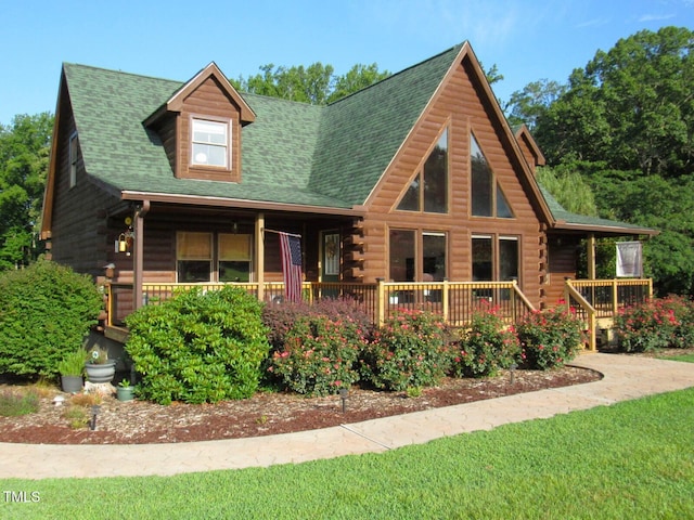1159 Flemingtown Rd, Henderson, NC 27537 - log cabin featuring log exterior, a shingled roof, a front lawn, and a wooden deck