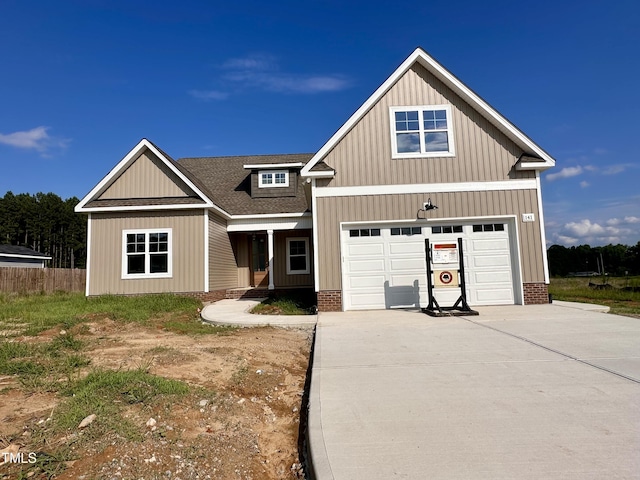 141 Noramac Ct, Selma, NC 27576 - view of front of property with driveway, a shingled roof, and a porch