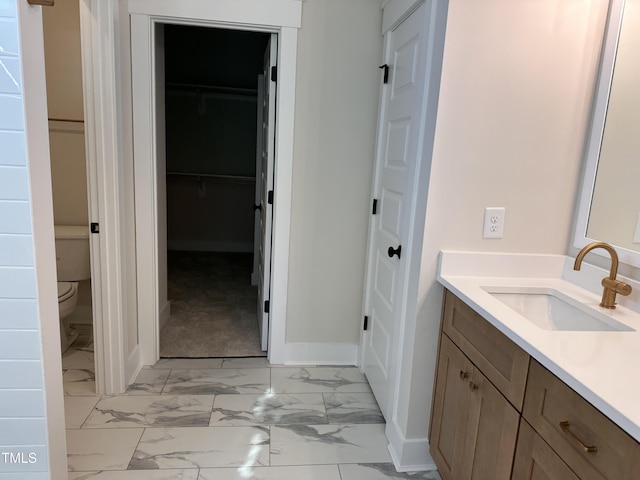 141 Noramac Ct, Selma, NC 27576 - bathroom featuring vanity, marble finish flooring, and a spacious closet