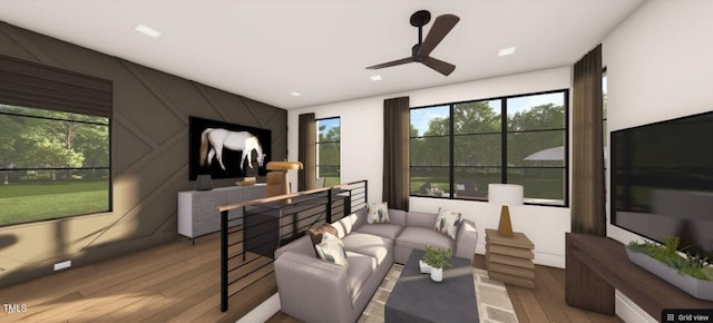 6804 Brixley Cir, Raleigh, NC 27614 - living room with plenty of natural light, wood finished floors, ceiling fan, and a decorative wall