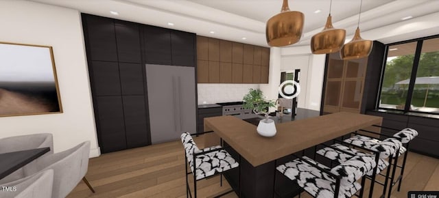 6804 Brixley Cir, Raleigh, NC 27614 - kitchen with a kitchen breakfast bar, backsplash, pendant lighting, dark countertops, and recessed lighting