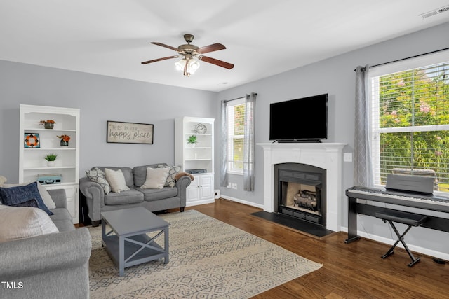 3716 Landshire View Ln, Raleigh, NC 27616 - living area with a fireplace, ceiling fan, and wood finished floors