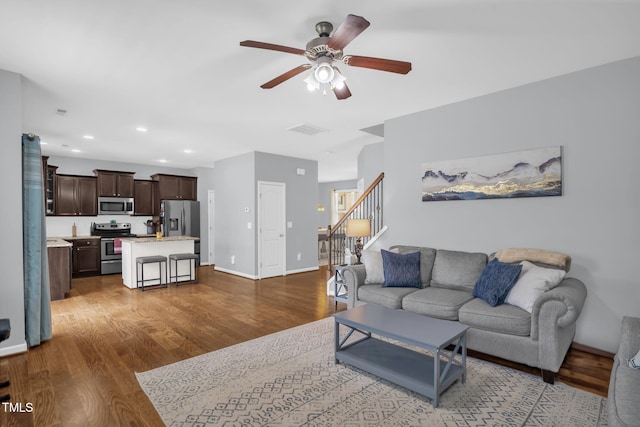 3716 Landshire View Ln, Raleigh, NC 27616 - living room with a ceiling fan, dark wood-style floors, stairs, and recessed lighting