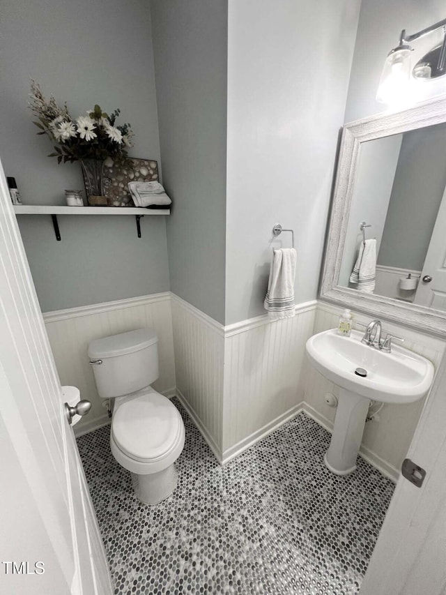 3716 Landshire View Ln, Raleigh, NC 27616 - bathroom featuring a wainscoted wall and tile patterned floors