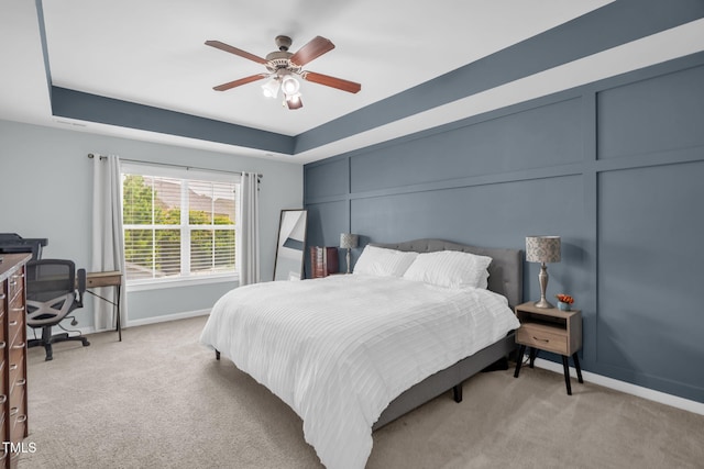 3716 Landshire View Ln, Raleigh, NC 27616 - bedroom with light colored carpet, a tray ceiling, and ceiling fan