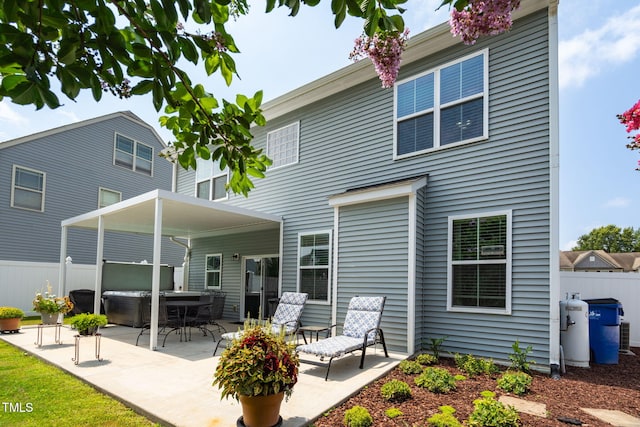 3716 Landshire View Ln, Raleigh, NC 27616 - rear view of house with a hot tub and a patio area