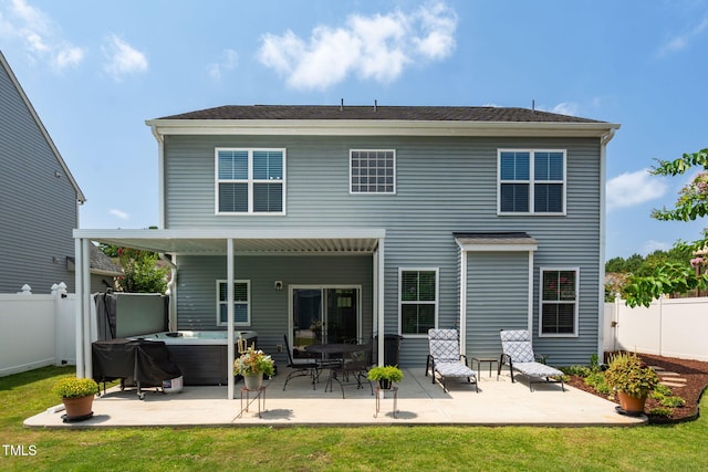 3716 Landshire View Ln, Raleigh, NC 27616 - back of house featuring a hot tub, a fenced backyard, and a patio