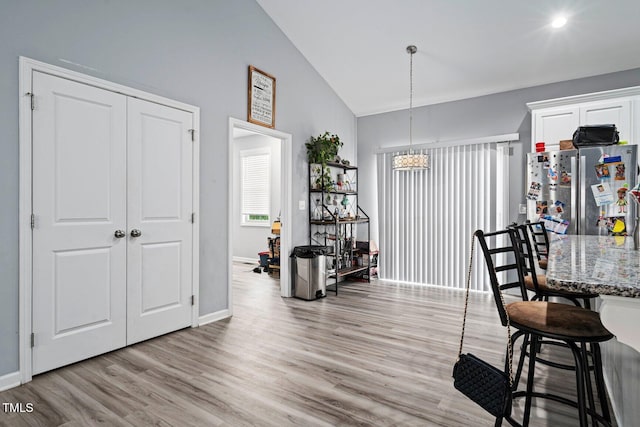 9448 S Beaver Creek Way, Middlesex, NC 27557 - dining area featuring light wood-style floors and high vaulted ceiling