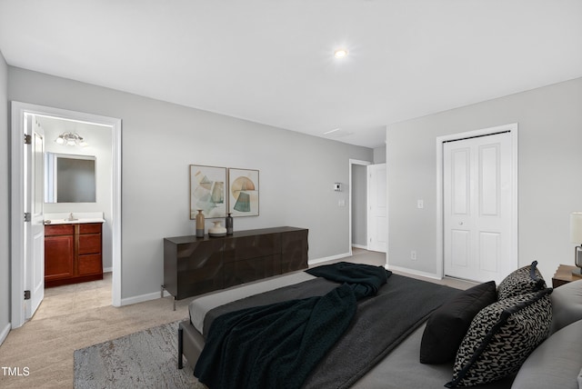 3 Windchime Ct, Durham, NC 27704 - bedroom with light carpet, a closet, and ensuite bath