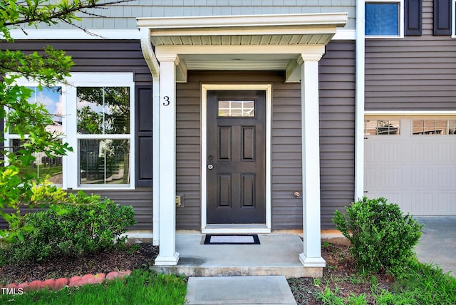 3 Windchime Ct, Durham, NC 27704 - property entrance with a garage and a porch