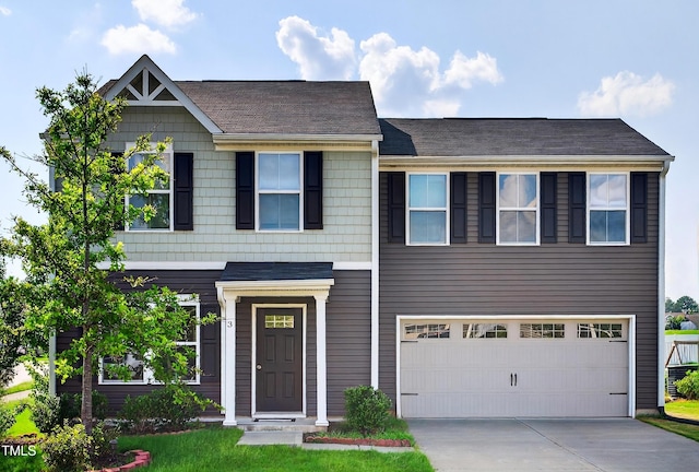 3 Windchime Ct, Durham, NC 27704 - view of front facade featuring driveway, a garage, and a shingled roof