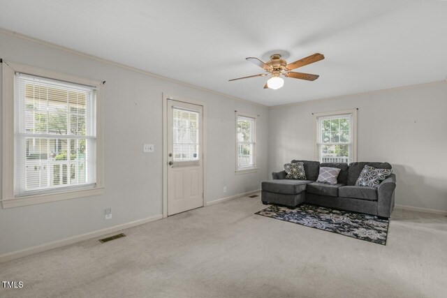 216 S Faison Ave, Faison, NC 28341 - carpeted living room featuring ceiling fan and crown molding
