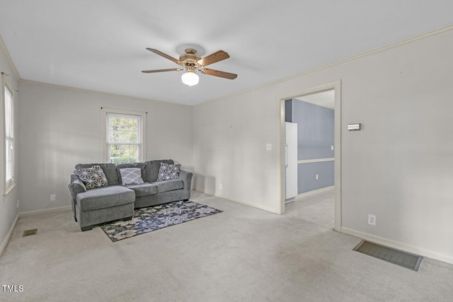 216 S Faison Ave, Faison, NC 28341 - carpeted living area with ornamental molding and a ceiling fan