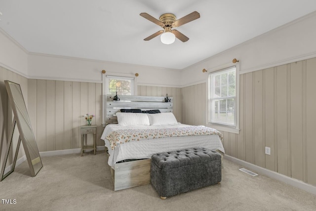 216 S Faison Ave, Faison, NC 28341 - bedroom featuring multiple windows, light carpet, and a ceiling fan