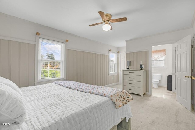 216 S Faison Ave, Faison, NC 28341 - bedroom with light carpet, ceiling fan, and ensuite bathroom