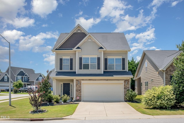701 Laurel Spring Dr, Fuquay Varina, NC 27526 - craftsman inspired home featuring concrete driveway, stone siding, board and batten siding, a garage, and a front lawn