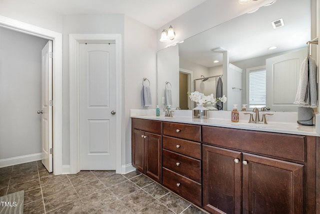 701 Laurel Spring Dr, Fuquay Varina, NC 27526 - bathroom featuring double vanity and a shower