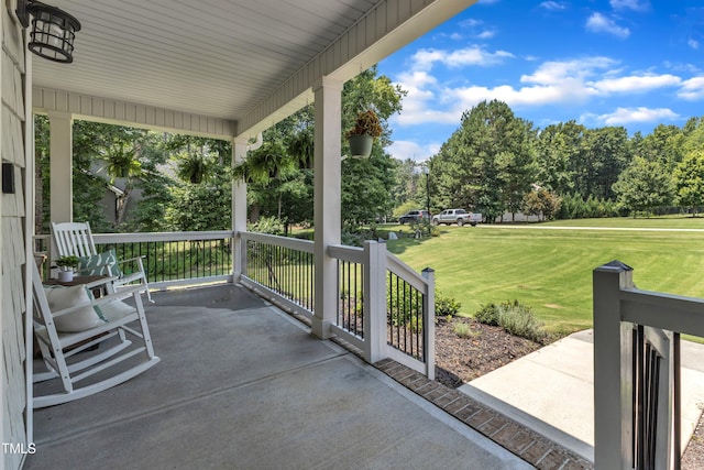 1725 River Club Way, Franklinton, NC 27525 - porch featuring a lawn and view of wooded area