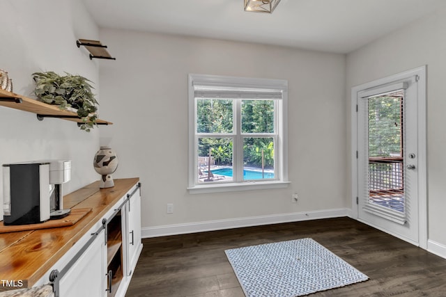 1725 River Club Way, Franklinton, NC 27525 - doorway with dark wood-type flooring and a barn door