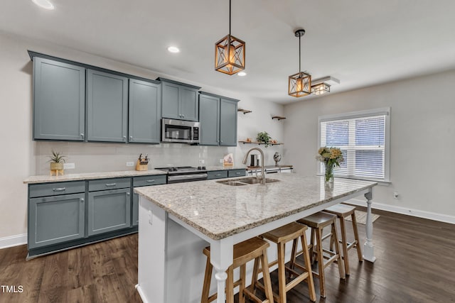 1725 River Club Way, Franklinton, NC 27525 - kitchen featuring stainless steel microwave, dark wood-style flooring, a breakfast bar area, light stone counters, and recessed lighting