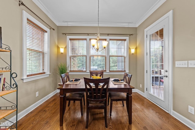 5005 Clyden Cv, Raleigh, NC 27612 - dining area with a chandelier, wood finished floors, plenty of natural light, and ornamental molding