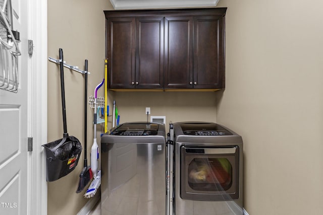5005 Clyden Cv, Raleigh, NC 27612 - washroom featuring washing machine and dryer and cabinet space