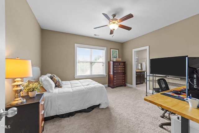 5005 Clyden Cv, Raleigh, NC 27612 - bedroom with light colored carpet, an office area, ensuite bath, and a ceiling fan
