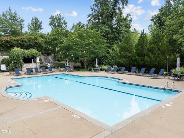 5005 Clyden Cv, Raleigh, NC 27612 - community pool featuring a patio area and view of scattered trees