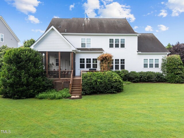 5005 Clyden Cv, Raleigh, NC 27612 - rear view of property with stairway, a sunroom, a lawn, and a shingled roof