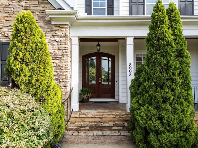5005 Clyden Cv, Raleigh, NC 27612 - entrance to property with french doors and stone siding