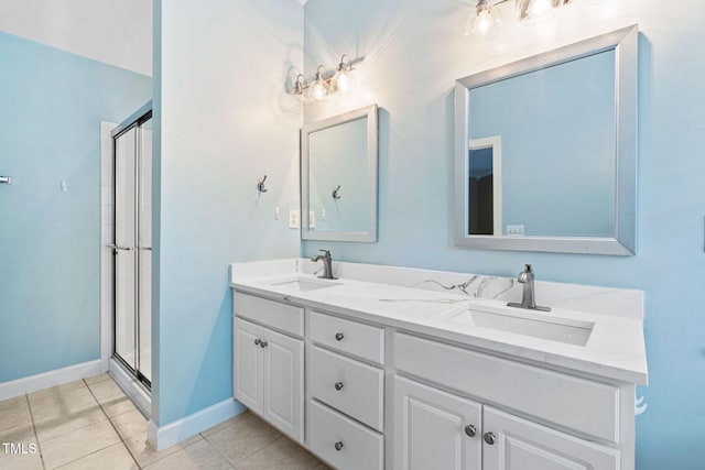 306 Kirkeenan Cir, Morrisville, NC 27560 - bathroom featuring double vanity, a shower stall, and tile patterned floors