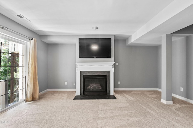 306 Kirkeenan Cir, Morrisville, NC 27560 - unfurnished living room with carpet floors, healthy amount of natural light, and a fireplace with flush hearth