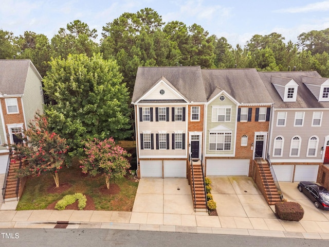 306 Kirkeenan Cir, Morrisville, NC 27560 - colonial inspired home with driveway, stairway, and an attached garage
