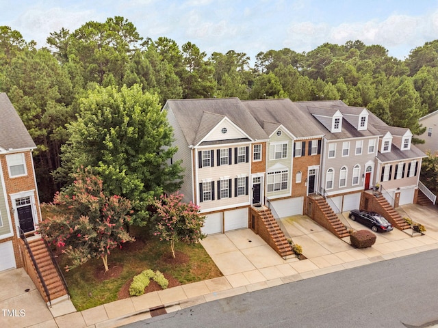 306 Kirkeenan Cir, Morrisville, NC 27560 - view of front of house with stairs, concrete driveway, and an attached garage