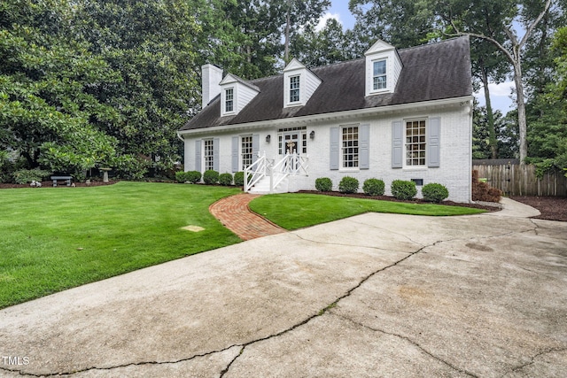 809 Blenheim Dr, Raleigh, NC 27612 - cape cod home featuring brick siding and a chimney