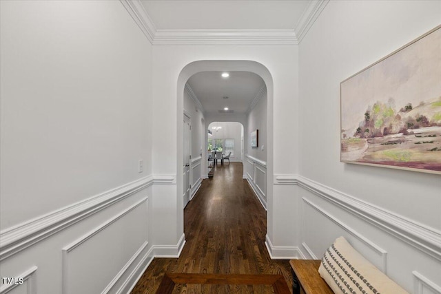 49 Brookridge Ct, Pittsboro, NC 27312 - hallway featuring crown molding, dark wood-style floors, arched walkways, a decorative wall, and wainscoting