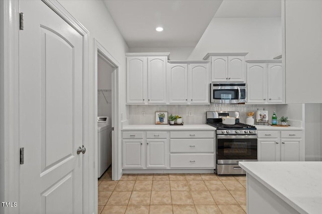 49 Brookridge Ct, Pittsboro, NC 27312 - kitchen featuring stainless steel appliances, white cabinetry, decorative backsplash, light tile patterned flooring, and recessed lighting