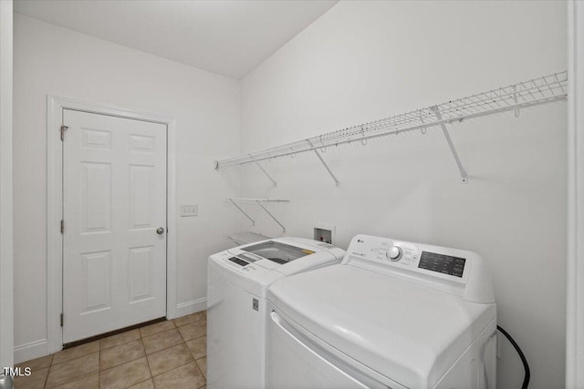 49 Brookridge Ct, Pittsboro, NC 27312 - laundry room with washing machine and clothes dryer and light tile patterned floors