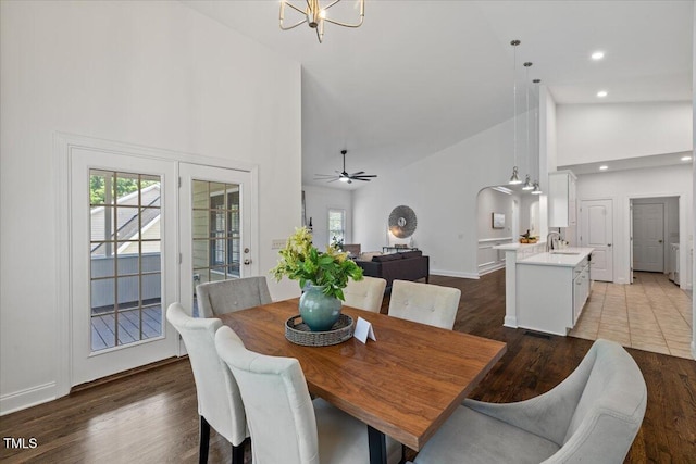 49 Brookridge Ct, Pittsboro, NC 27312 - dining room with high vaulted ceiling, dark wood-style floors, a chandelier, arched walkways, and a ceiling fan