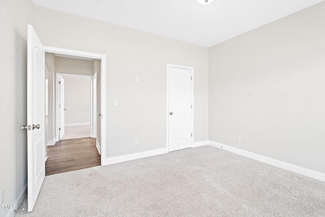 6531 Knob Creek Dr, Whitsett, NC 27377 - unfurnished bedroom featuring carpet and baseboards