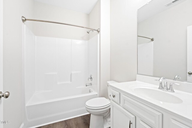 6531 Knob Creek Dr, Whitsett, NC 27377 - full bath featuring vanity, wood finished floors, and bathtub / shower combination