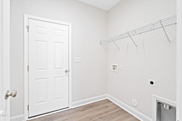 6531 Knob Creek Dr, Whitsett, NC 27377 - washroom with hookup for a washing machine, light wood-type flooring, electric dryer hookup, and hookup for a gas dryer