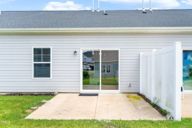 6531 Knob Creek Dr, Whitsett, NC 27377 - rear view of property featuring roof with shingles and a patio area