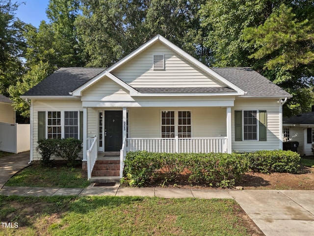 305 Justice Heights St, Apex, NC 27502 - bungalow-style home featuring a porch and a shingled roof