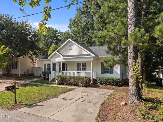 305 Justice Heights St, Apex, NC 27502 - bungalow with a porch, roof with shingles, a front lawn, and crawl space