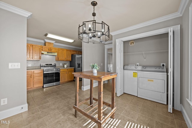 305 Justice Heights St, Apex, NC 27502 - kitchen with stainless steel appliances, under cabinet range hood, washing machine and clothes dryer, crown molding, and a chandelier